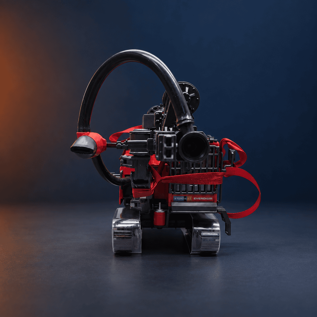 Front view of the D800 miniature showing the curved dust-extraction hose