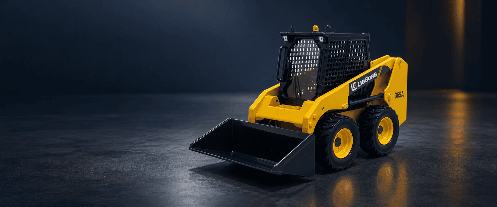 LiuGong 365A skid steer loader scale model in a dark industrial studio setting