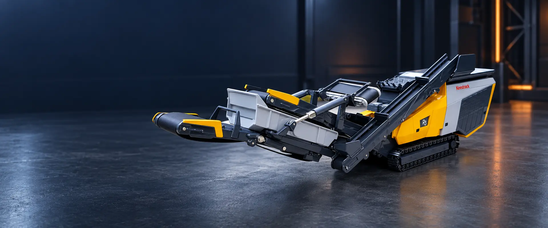 Keestrack R3 tracked impact crusher scale model in a dark industrial studio setting