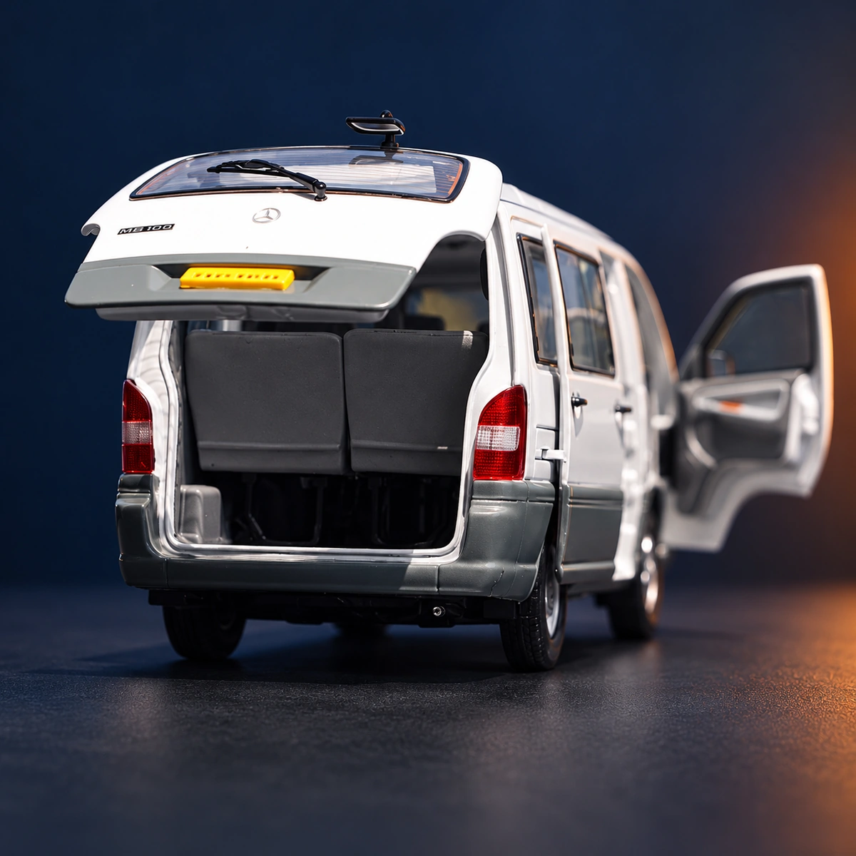 Rear view of the MB100 model showing seat backs, rear lamps and glazing in the raised tailgate