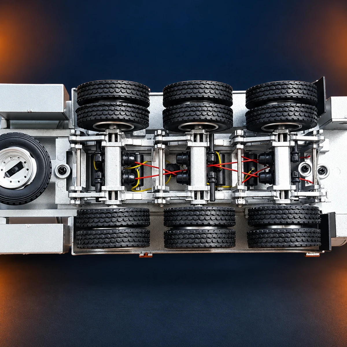Visible axle and suspension components beneath the tanker trailer model